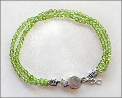 A handmade peridot bracelet, sterling silver clasp, good for Chi (Qi), chakra, acupuncture, alternative medicine, holistic medicine, health, wellbeing, happiness, harmony