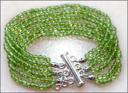 A handmade peridot bracelet, sterling silver clasp, good for Chi (Qi), chakra, acupuncture, alternative medicine, holistic medicine, health, wellbeing, happiness, harmony