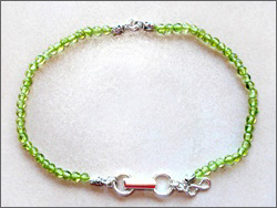 A handmade peridot anklet/bracelet, healing jewelry. promote Qi (Chi) flow, sterling silver clasp, good for Chi (Qi), chakra, acupuncture, alternative medicine, holistic medicine, health, wellbeing, happiness, harmony